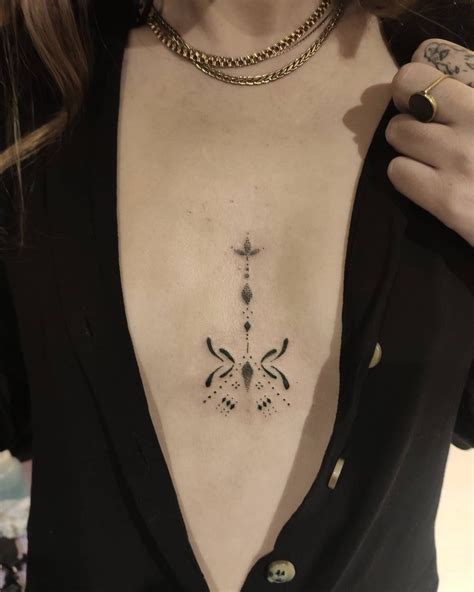 inbetween boob tattoo|Inbetween breast tattoo